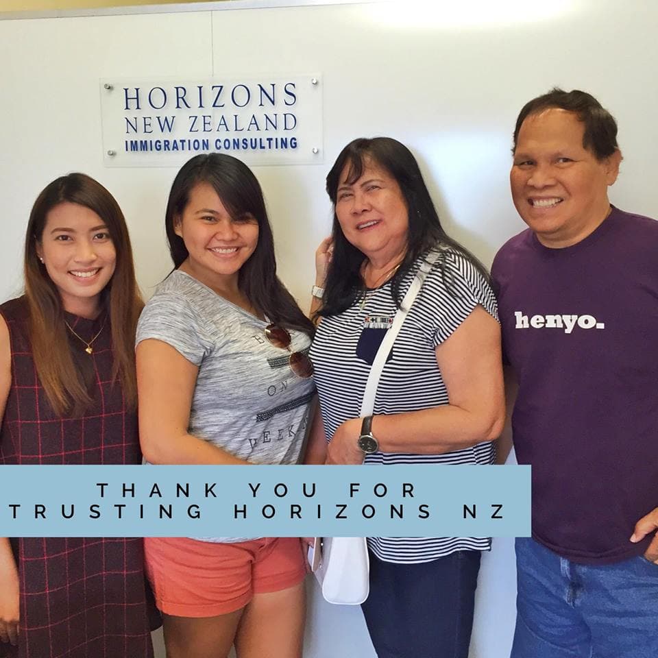 The Alombro family at the Horizons office after their visa approval